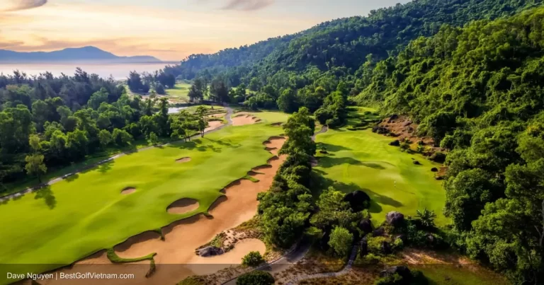 Laguna Lang Co Golf Club Faldo Signature fairway with lagoon and mountains Hue Vietnam