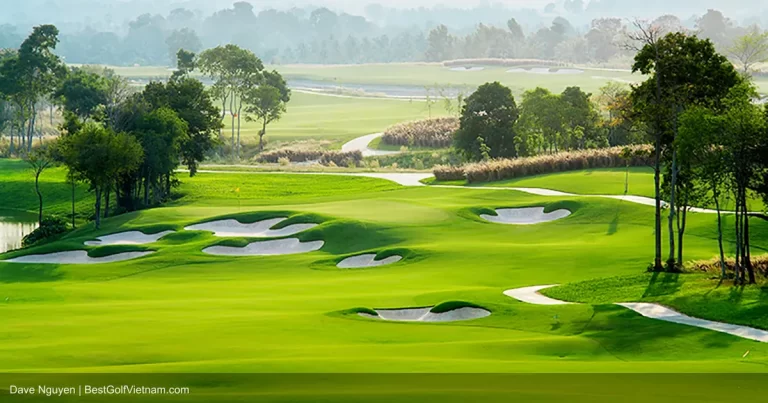 Vinpearl Golf Nam Hoi An green with lake and tropical palm trees Vietnam